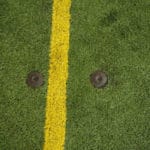 Small divets in floor of soccer turf at Avanti's dome