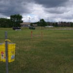 Practice jump in fenced ring at CACM agility trial, St Cloud MN