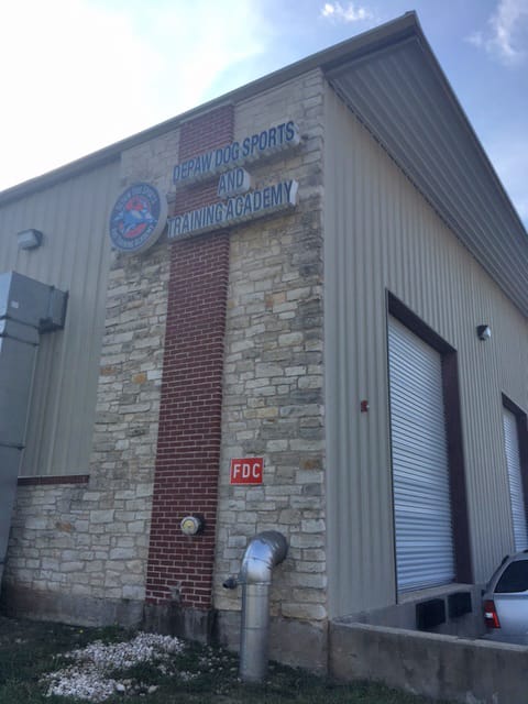 Exterior of building and sign for DePaw Dog Sports and Training Academy, Leander TX