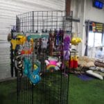 stuffed and squeaky dog toys on display rack at -BellaVistaTraining-LewisberryPA