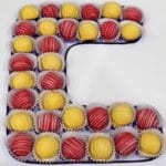 letter "C" in Mach made from cupcake candies