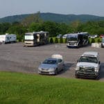 RVs camped in crushed stone lot at SportsZone-NorthumberlandPA
