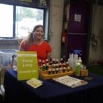 Sarah in front of her display for Young Living essential oils