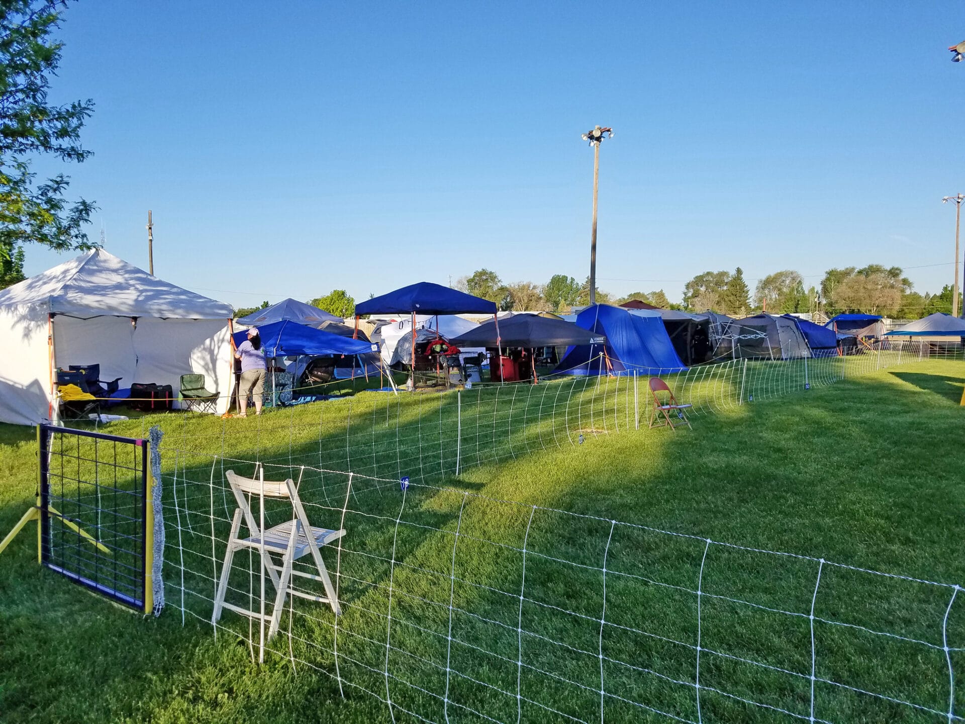 easy up tents and dog crates along side of agility ring at East Idaho Fairgrounds-BlackfootID