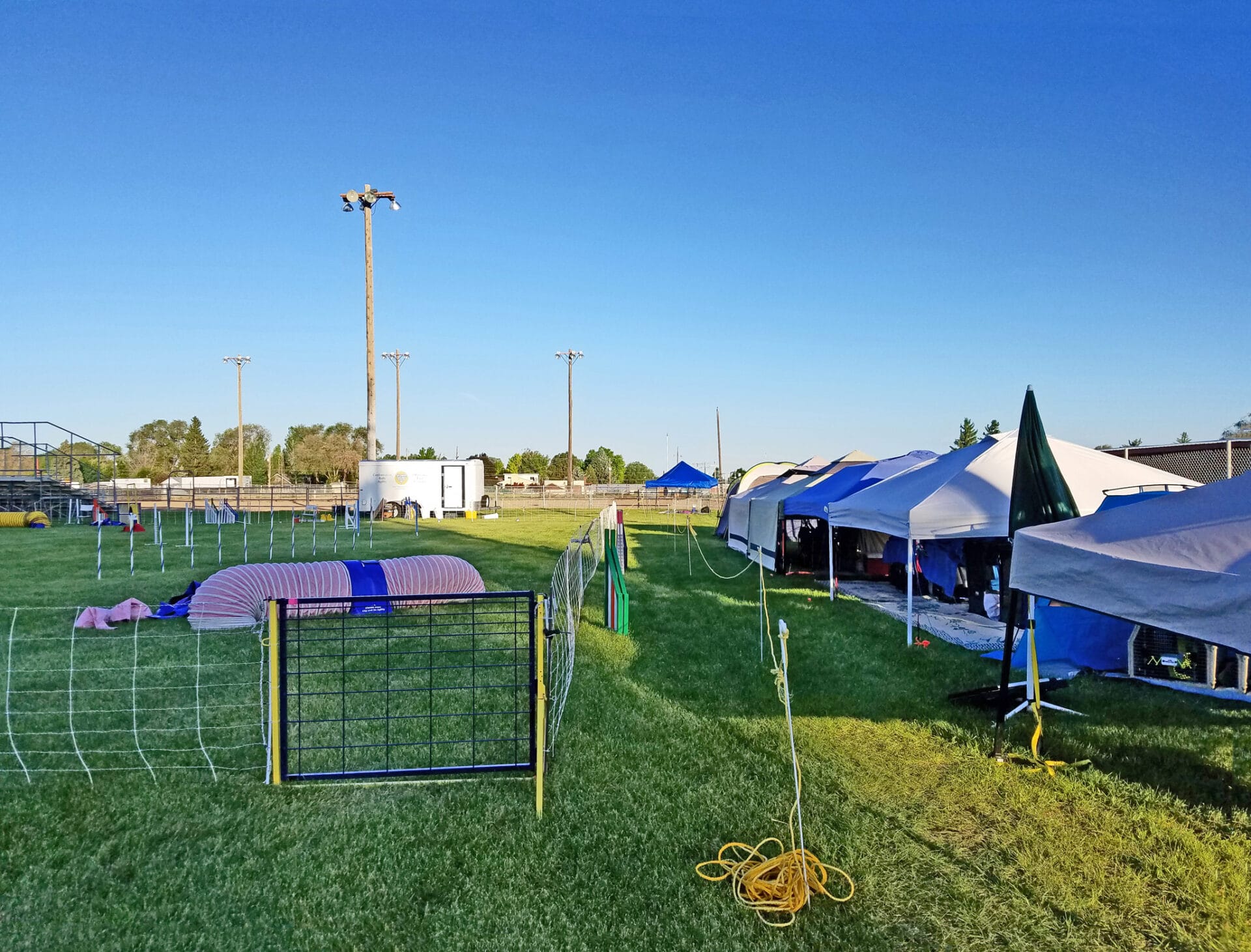 easy up tents and dog crates along side of agility ring on right side of ring at East Idaho Fairgrounds-BlackfootID