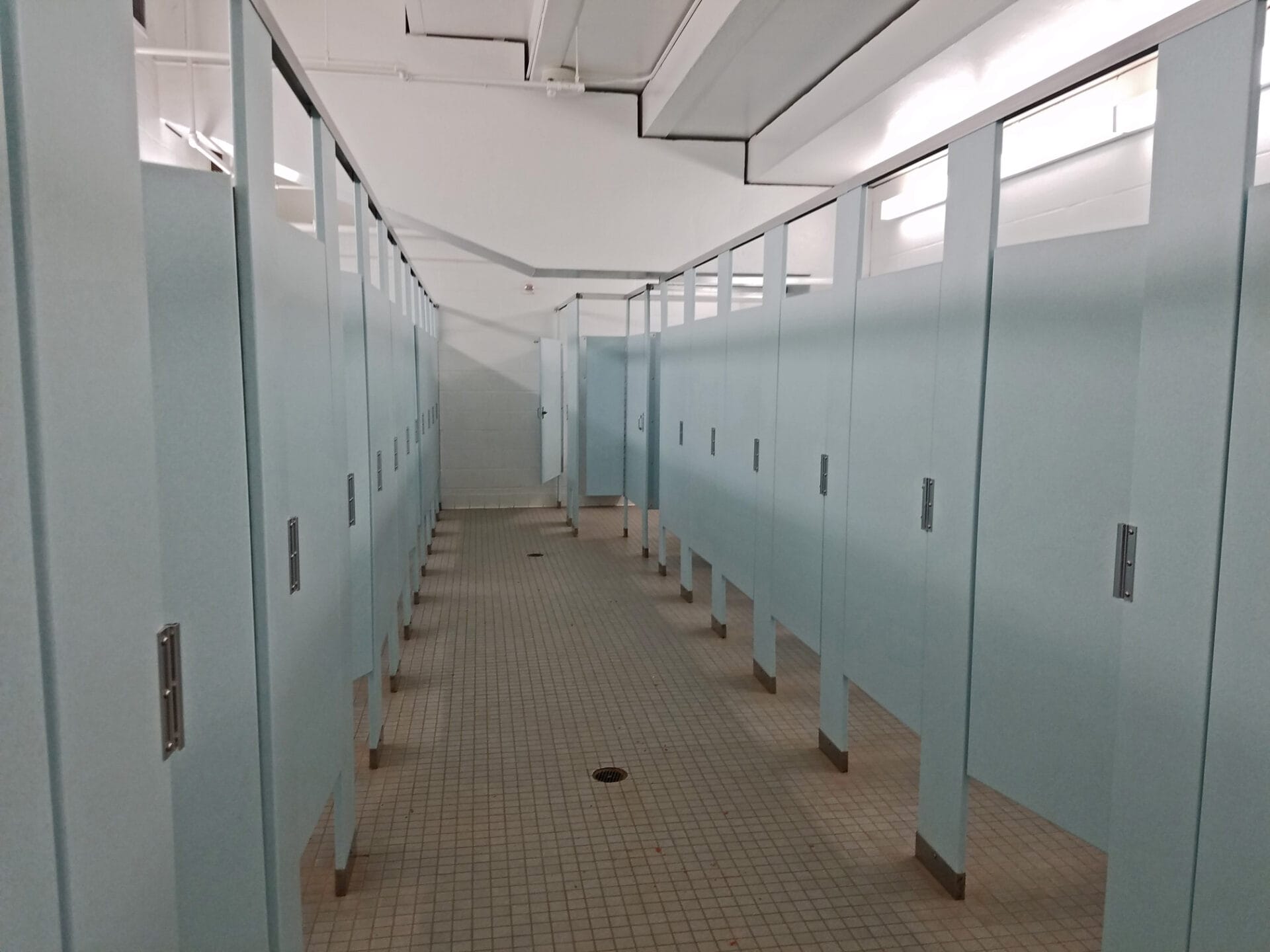 long row with bathroom stalls on both sides at Turner Agri-Civic Center, Arcadia FL
