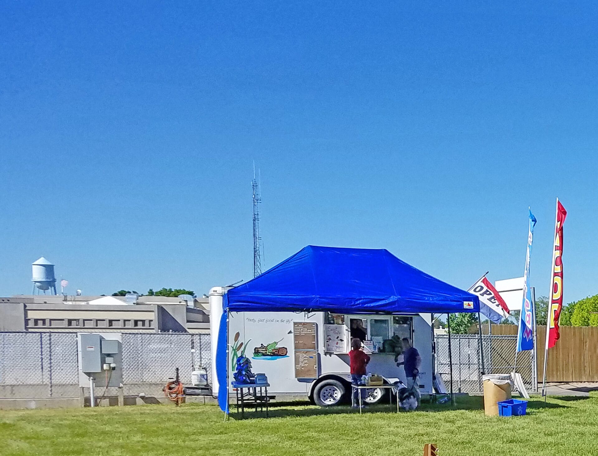food vendor truck and tent at easy up tents and dog crates along side of agility ring at East Idaho Fairgrounds-BlackfootID