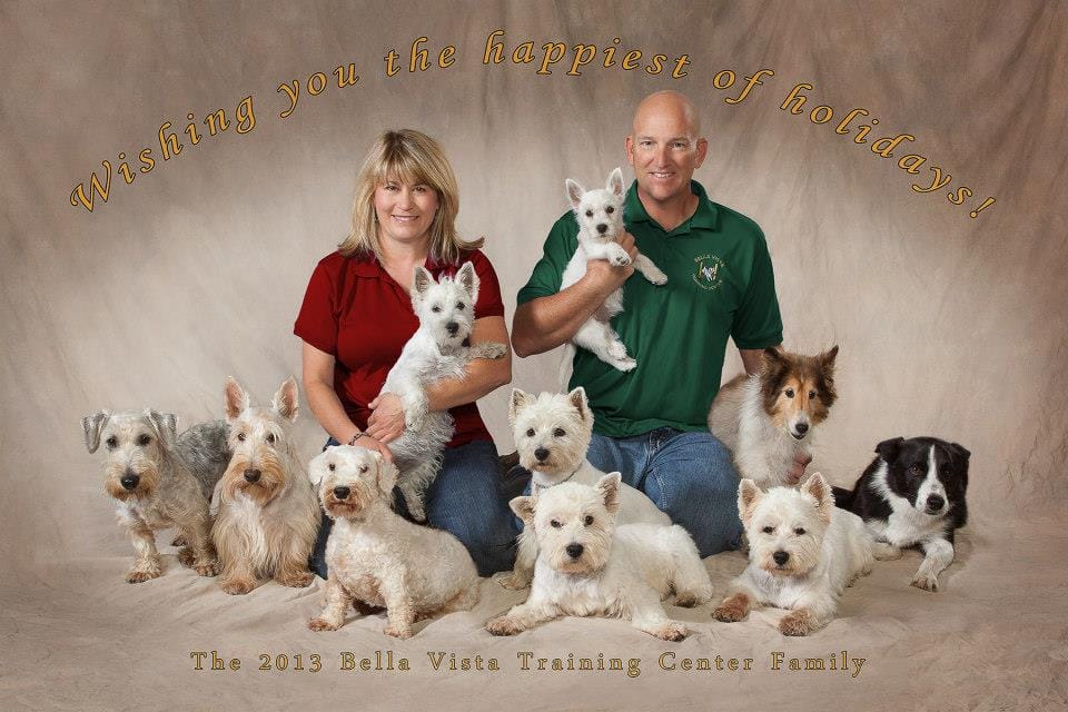 Stephanie Capkovic and Rob Kirpaitis, owners of Bella Vista Training Center with 10 dogs: 5 West Highland Terriers, miniature Schnauzer, Sheltie, Scottish Terrier,  Border Collie, mixed breed