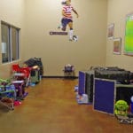 Small crating room with kennels against the walls Soccer World, Rochester MN