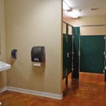 Stalls and sink inside of women's restroom Soccer World, Rochester MN