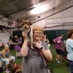 Deb Stevenson and with her rat terrier Ferris B on her shoulder, waiting to run at Sports Domain Academy, Clifton NJ