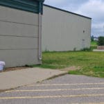 Grass and concrete outdoor dog potty area Soccer World, Rochester MN