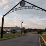 Iron arch displaying "Silver Street Park" over entrance road to Silver Street Park, New Albany IN