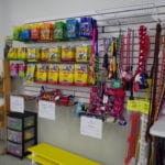 Toys, Treats, Training Aids and leashes displayed on wall for sale at Fusion Pet Retreat, Minnetonka MN