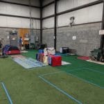 Dog crates and tent set up in corner of facility Pawsitive Partners, Indianapolis IN