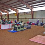 Dog crates lined up in area of Dirt Floor Arena at South St. Louis County Fairgrounds, Dirt Floor Arena, Proctor MN