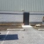 Asphalt and grassy dog potty area next to facility door Yellow Breeches Sports Center, New Cumberland PA