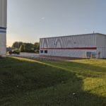 Grassy area, building and parking lot at Pawsitive Partners, Indianapolis IN