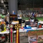 Trial secretary table with awards, banners, and crated dog beneath Yellow Breeches Sports Center, New Cumberland PA