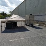 Tent, grill and food equipment before vendor setup in the facility parking lot Yellow Breeches Sports Center, New Cumberland PA