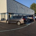 Cars parked next to building entrance on asphalt lot Pawsitive Partners, Indianapolis IN