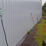 Electrical cords from RVs plugged into outlets along the building at South St. Louis County Fairgrounds, Dirt Floor Arena, Proctor MN