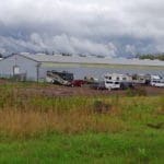 RVs parked in dirt area beside arena building at South St. Louis County Fairgrounds, Dirt Floor Arena, Proctor MN