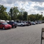 RV parked in asphalt parking lot behind cars Yellow Breeches Sports Center, New Cumberland PA