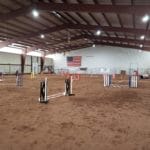 Agility jumpers with weaves course set up at South St. Louis County Fairgrounds, Dirt Floor Arena, Proctor MN