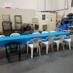 Long covered table with chairs set up along sides Dog Training Club of St. Petersburg, St. Petersburg FL
