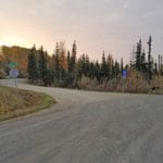 View of dirt road and navigation signs to facility Camp Li-Wa, Fairbanks AK