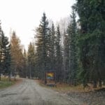 Entrance sign and road to camp grounds Camp Li-Wa, Fairbanks AK