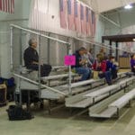 Visitors sitting on bleachers facing the ring National Equestrian Center, Lake St Louis MO