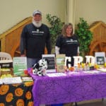 Penny Reinisch from Hemp Worx behind CBD products table National Equestrian Center, Lake St Louis MO