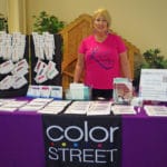 Sue Sharp from Color Street behind vendor table National Equestrian Center, Lake St Louis MO