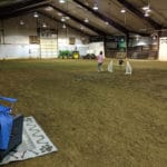 warm up agility jump on dirt floor in wide open roomat -MTSU-Livestock-Center-MurfreesboroTN
