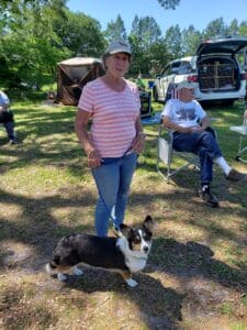 owner of Paw's & Que's and her Corgi