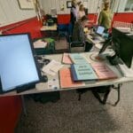 monitor on table and notebooks showing running results - agility at the farm, campton hills, il