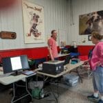 trial secretary standing at table - agility at the farm, campton hills, il