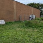 rear exit door to dog potty area at forest city dog training club in love's park il taken from exterior