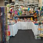 vendor u-shaped booth with leashes, collars, treats and toys at forest city dog training club in love's park il