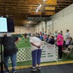 entry to agility ring with running order monitor at forest city dog training club in love's park il